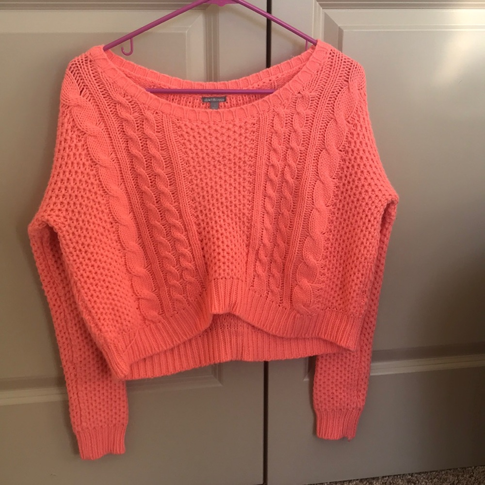 Orange sweater.